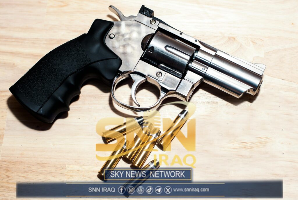 Silver revolver and bullets on a wooden surface illustrating security themes.